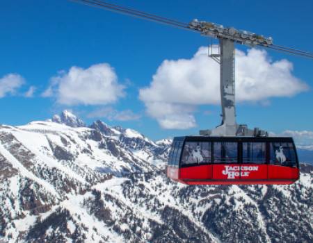 Tram against winter mountains